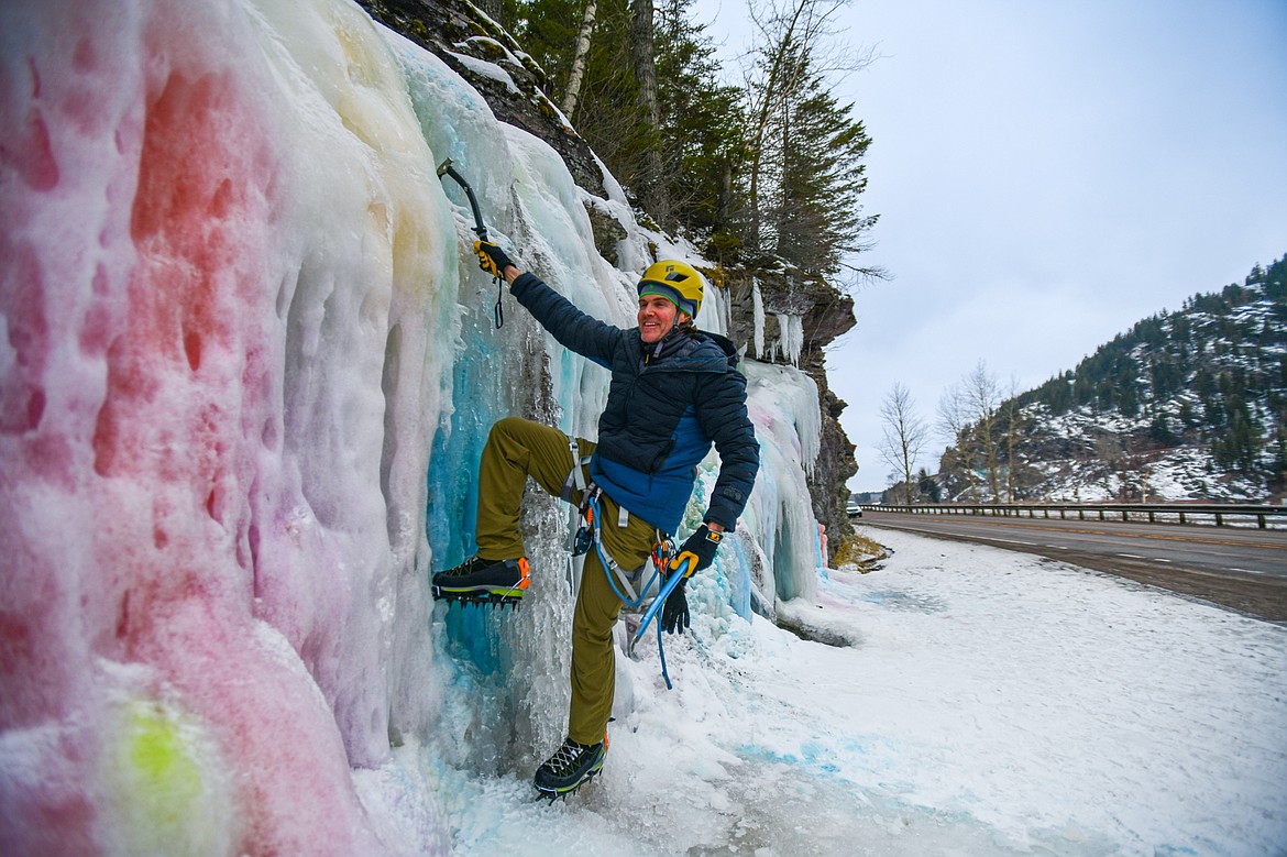 Jeff Birchfield digs into the ice at Bad Rock Canyon on Saturday, Feb. 10. (Casey Kreider/Daily Inter Lake)