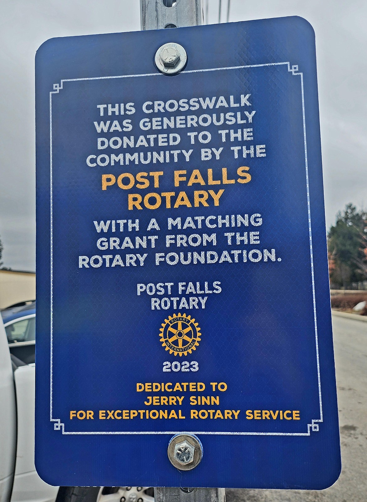 A flashing crosswalk signal in Post Falls was donated to the community by Post Falls Rotary Club and dedicated to longtime Rotarian Jerry Sinn during a Feb. 7 presentation.