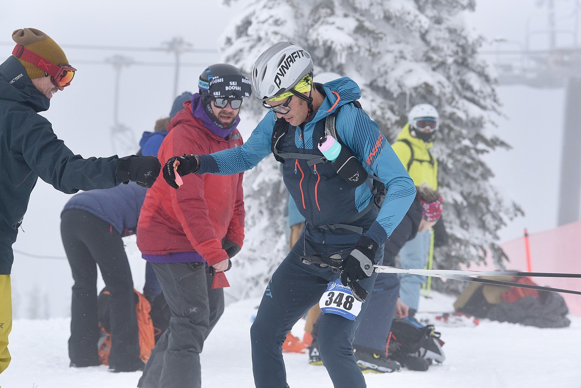 Brandon French gets a fist bump from a fan during the Whitefish Whiteout skimo race at Whitefish Mountain Resort on Saturday, Feb. 10, 2024. (Matt Baldwin/Whitefish Pilot)