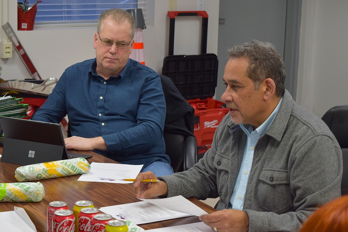 The Port of Mattawa’s new Executive Director, Gil Alvarado, right, discusses port business with the port commissioners and the port’s Public Affairs Consultant Patrick Boss, left, during Monday’s regular meeting.