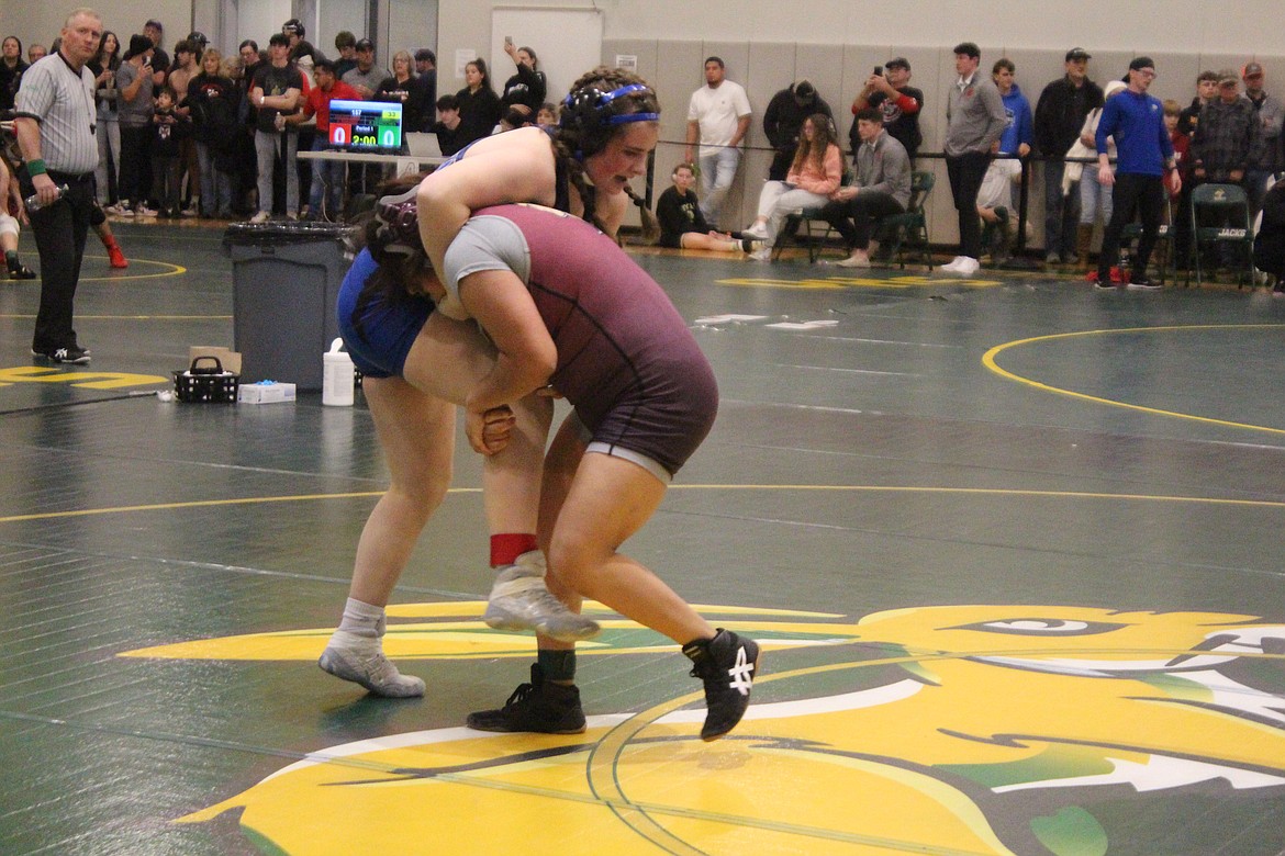 Angela Santiago, Wahluke, in maroon, makes a move on her opponent at Saturday’s Region 4 tournament in Quincy. Santiago finished fourth and will be an alternate at Mat Classic XXXV next weekend.