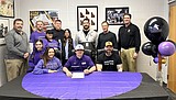 Signing photos Feb. 15, 2024