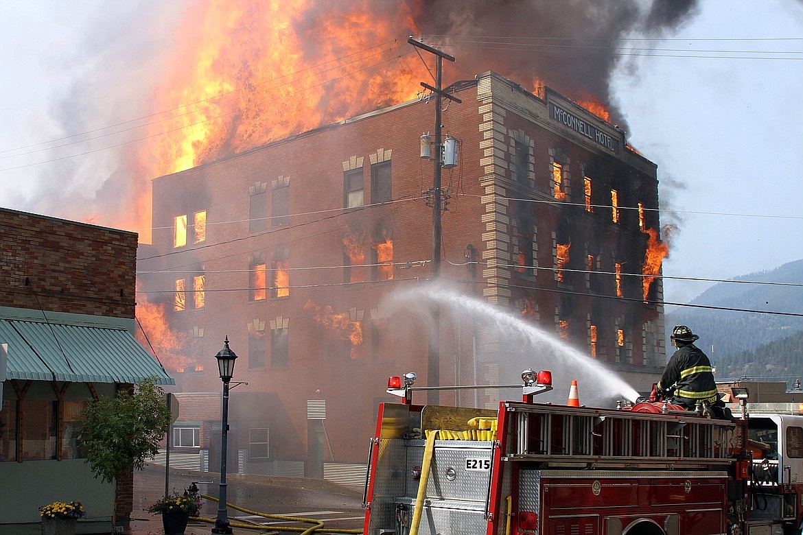 Fire crews from Shoshone County Fire Department No. 1 respond to the McConnell Hotel fire on Aug. 29, 2017.