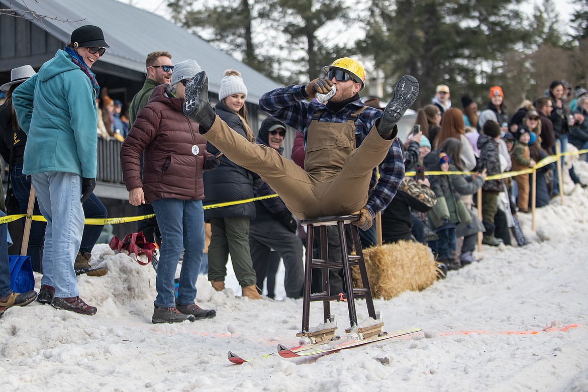 Bar stool ski racers make their way down Sugar Hill in Martin City for Cabin Fever Days Saturday, Feb. 10. Fifty-six racers participated, and an estimated $10,000-plus was raised for Badrock Canyon first responders. (Avery Howe photo)