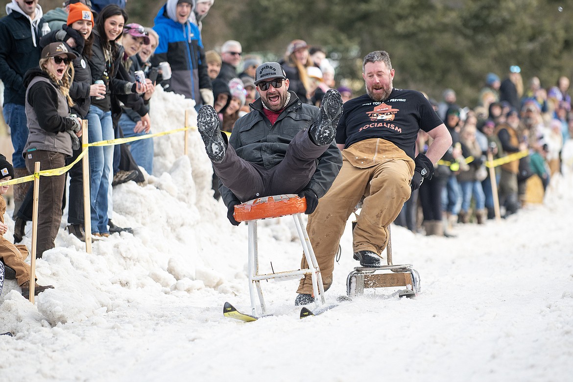 Bar stool ski racers make their way down Sugar Hill in Martin City for Cabin Fever Days Saturday, Feb. 10. Fifty-six racers participated, and an estimated $10,000-plus was raised for Badrock Canyon first responders. (Avery Howe photo)