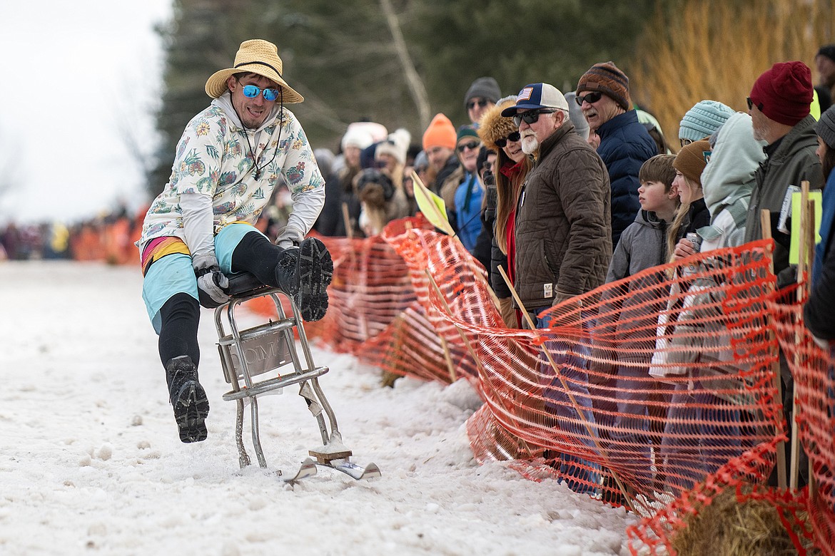 Bar stool ski racers make their way down Sugar Hill in Martin City for Cabin Fever Days Saturday, Feb. 10. Fifty-six racers participated, and an estimated $10,000-plus was raised for Badrock Canyon first responders. (Avery Howe photo)