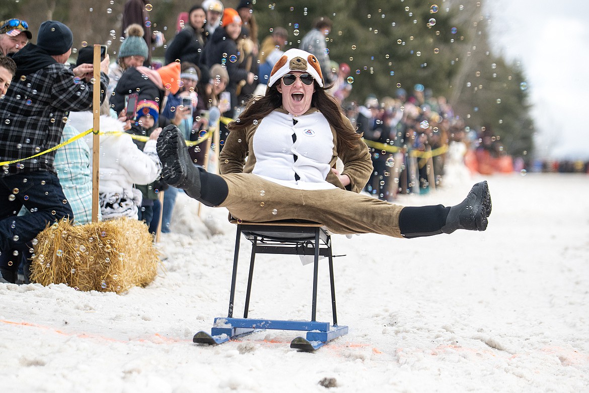 Bar stool ski racers make their way down Sugar Hill in Martin City for Cabin Fever Days Saturday, Feb. 10. Fifty-six racers participated, and an estimated $10,000-plus was raised for Badrock Canyon first responders. (Avery Howe photo)