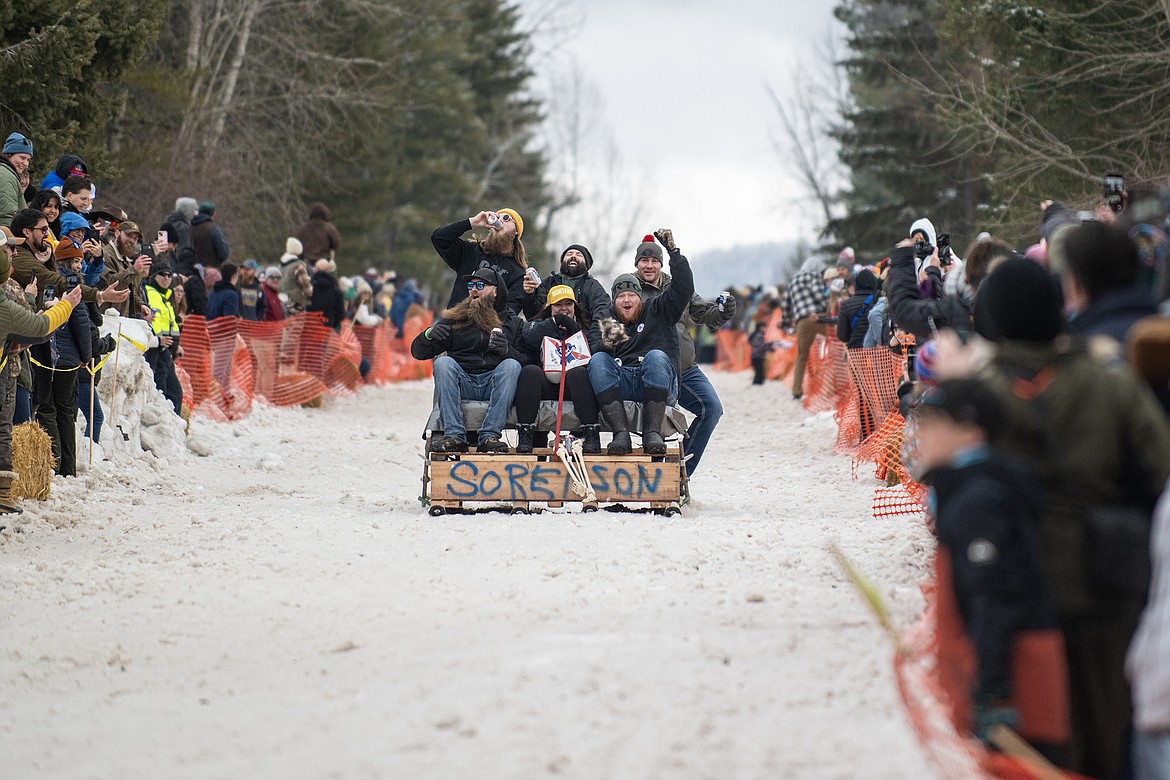 Bar stool ski racers make their way down Sugar Hill in Martin City for Cabin Fever Days Saturday, Feb. 10. Fifty-six racers participated, and an estimated $10,000-plus was raised for Badrock Canyon first responders. (Avery Howe photo)