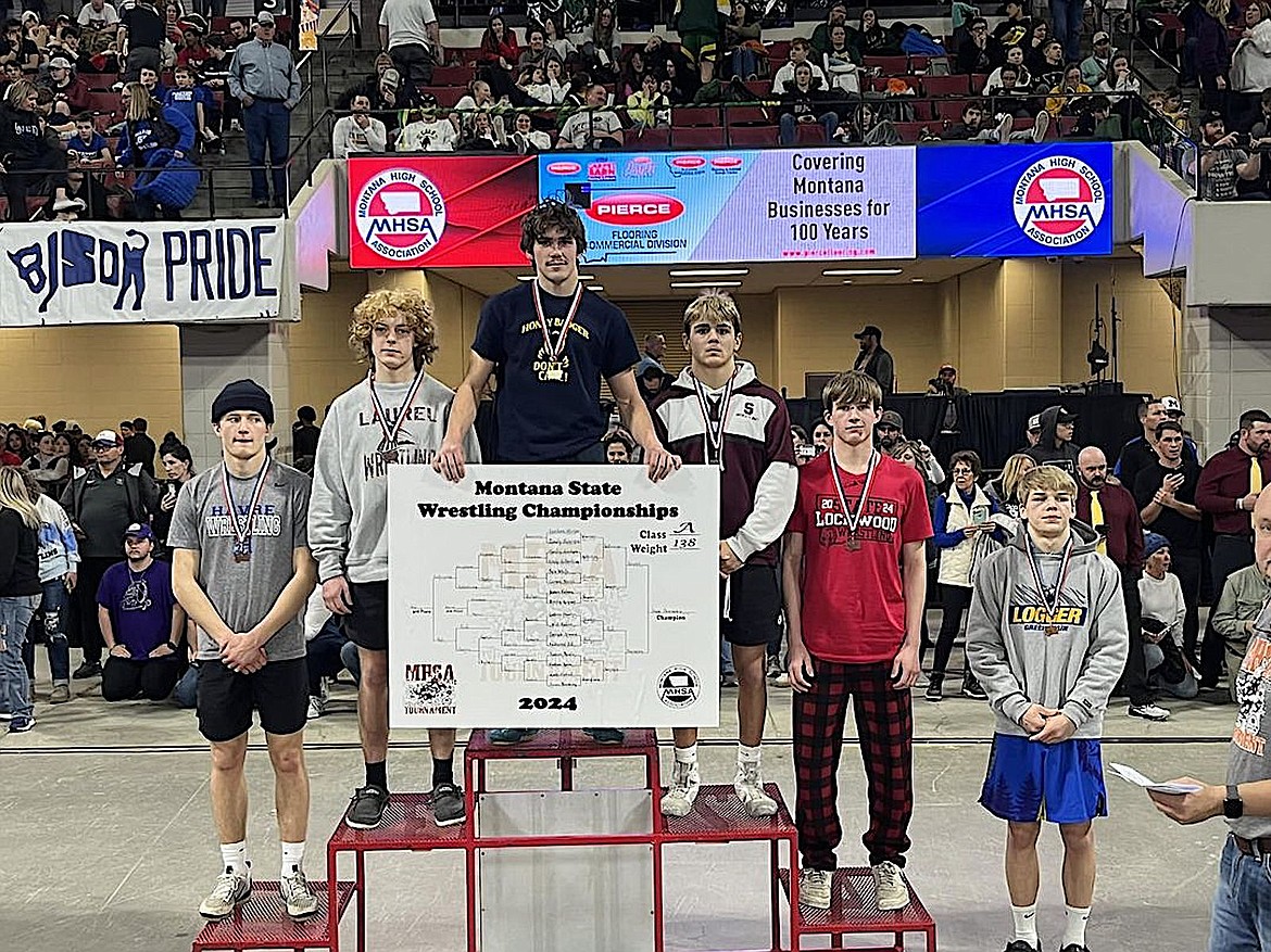 Libby Greenchain senior Marley Erickson, far right, placed sixth last weekend at the Montana High School Association Class A wrestling championships in Billings to earn his first medal. (Photo courtesy Greenchain Wrestling Club)