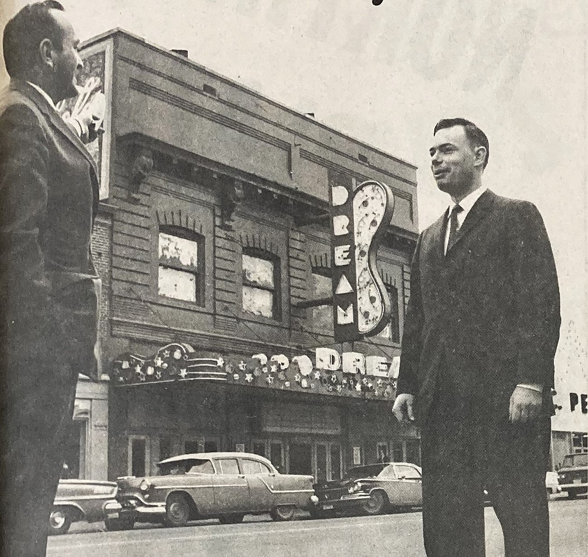 Manager John Hunt of First Security Bank, left, and Roger Dedman of the Dream Theater, background, hobnob.