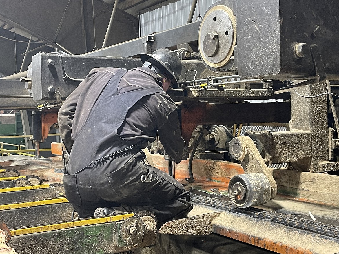 Dylan Chapman works on a machine at an Idaho Forest Group plant. The Sandpoint High School graduate recently completed the company's millwright apprenticeship program and is now an industrial electrician apprentice.