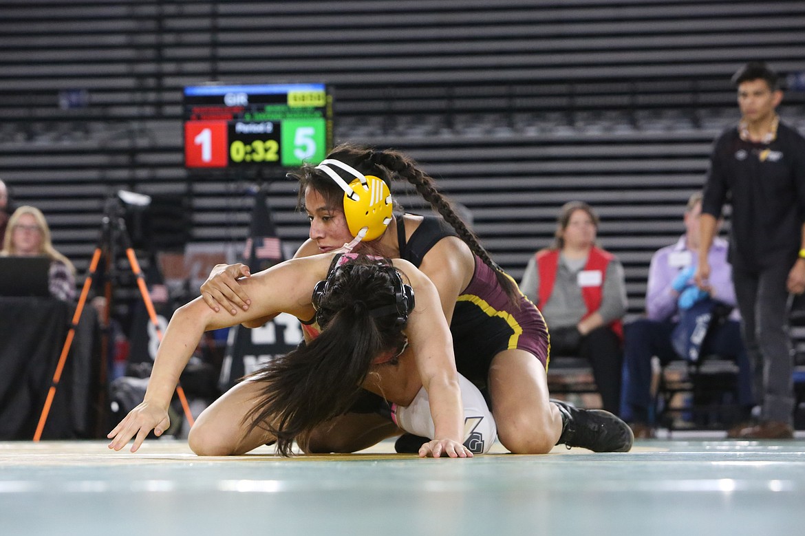 Moses Lake senior Ashley Naranjo, background, is seeking her third straight state championship at the 2024 Mat Classic.