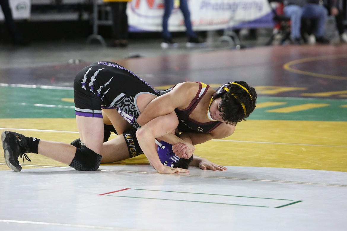 Moses Lake sophomore Ian Garza, right, is one of three Maverick boys wrestlers returning to the Mat Classic this week.