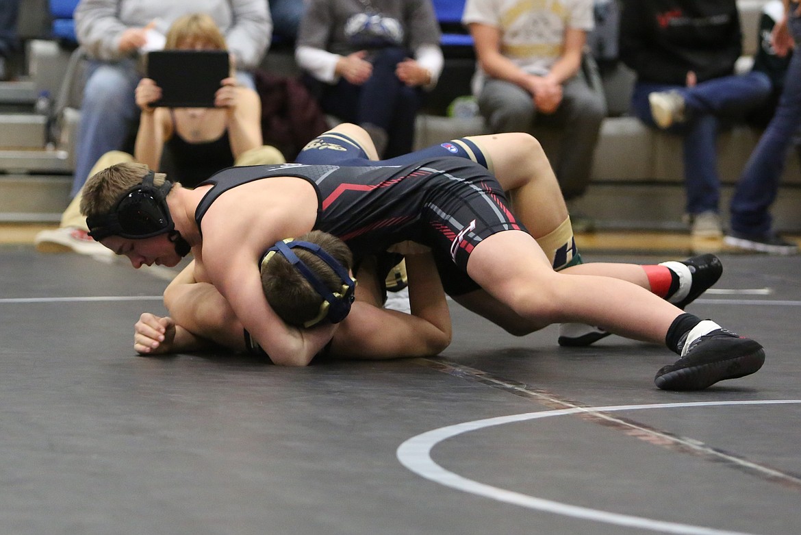 ACH freshman Porter Wood, top, is one of five Warriors heading to Tacoma for the 2024 Mat Classic.