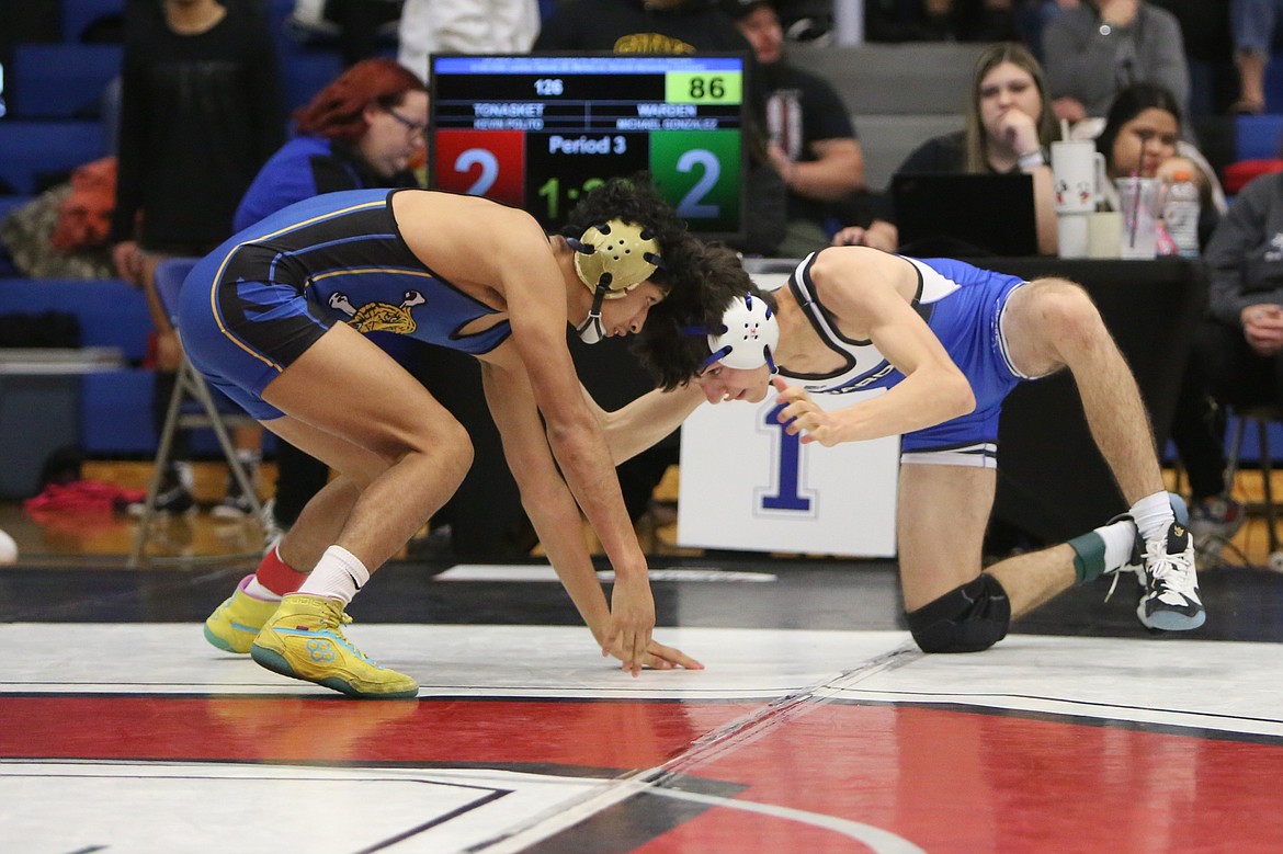 Warden junior Michael Gonzalez, right, qualified for his third straight Mat Classic.