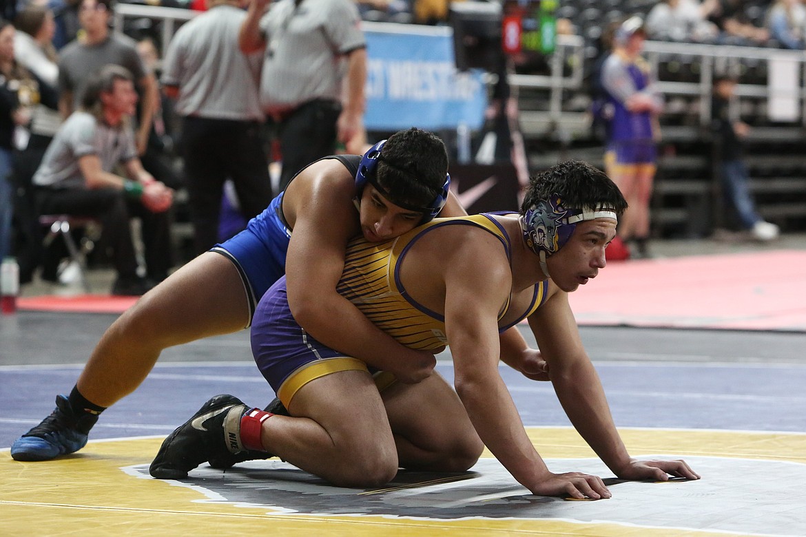 Warden freshman Jaden Hernandez, left, wrestles at the Eastern Washington Athletic Conference (East) tournament in Yakima.