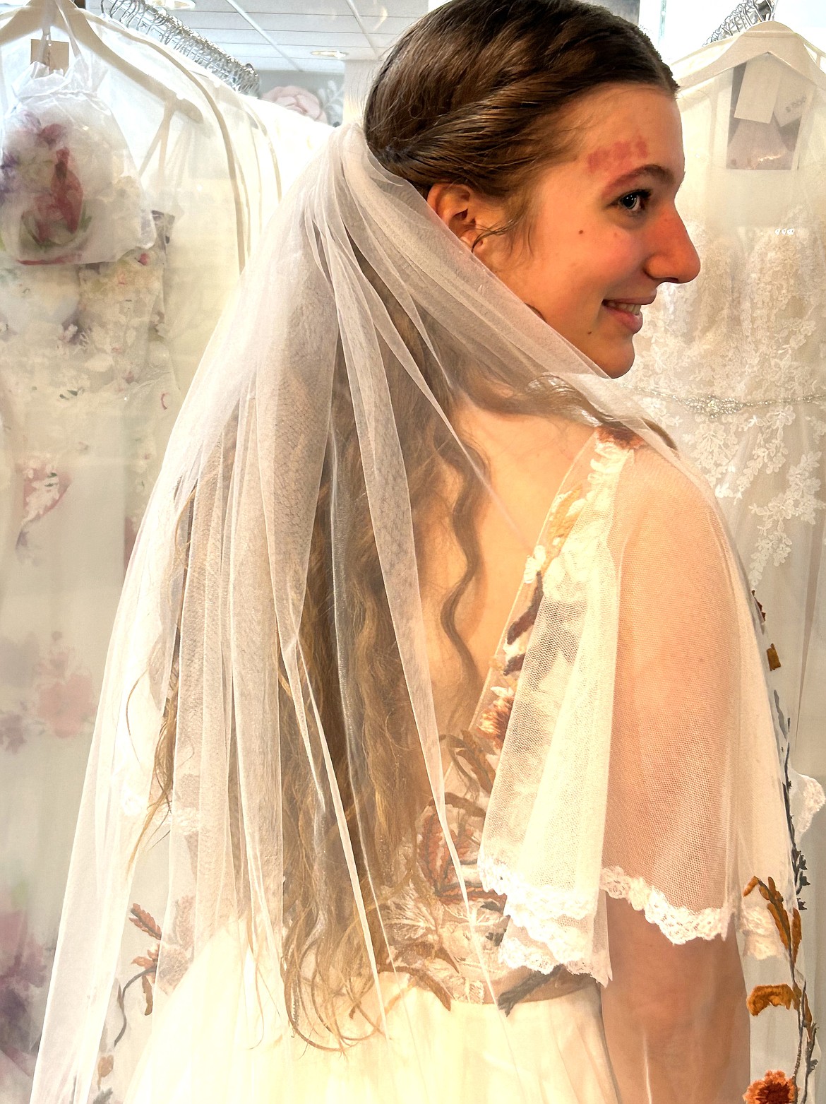 Josie Deuel models a wedding dress created by Anne Kuypers for the Seventh Heaven fashion show on Saturday.