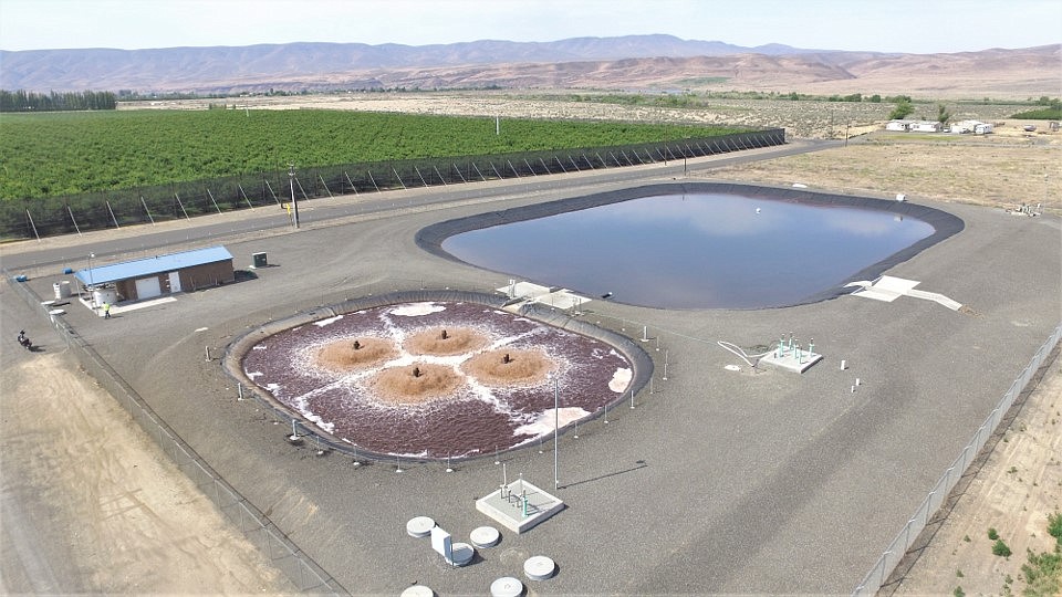 An aerial view of the Port of Mattawa’s wastewater treatment plant. When operating normally, the plant treats waste from Wahluke Wine Co. and stores it in the lagoon, pictured on the right. Port Commissioners voted unanimously Monday to approve staff to sell the plant.