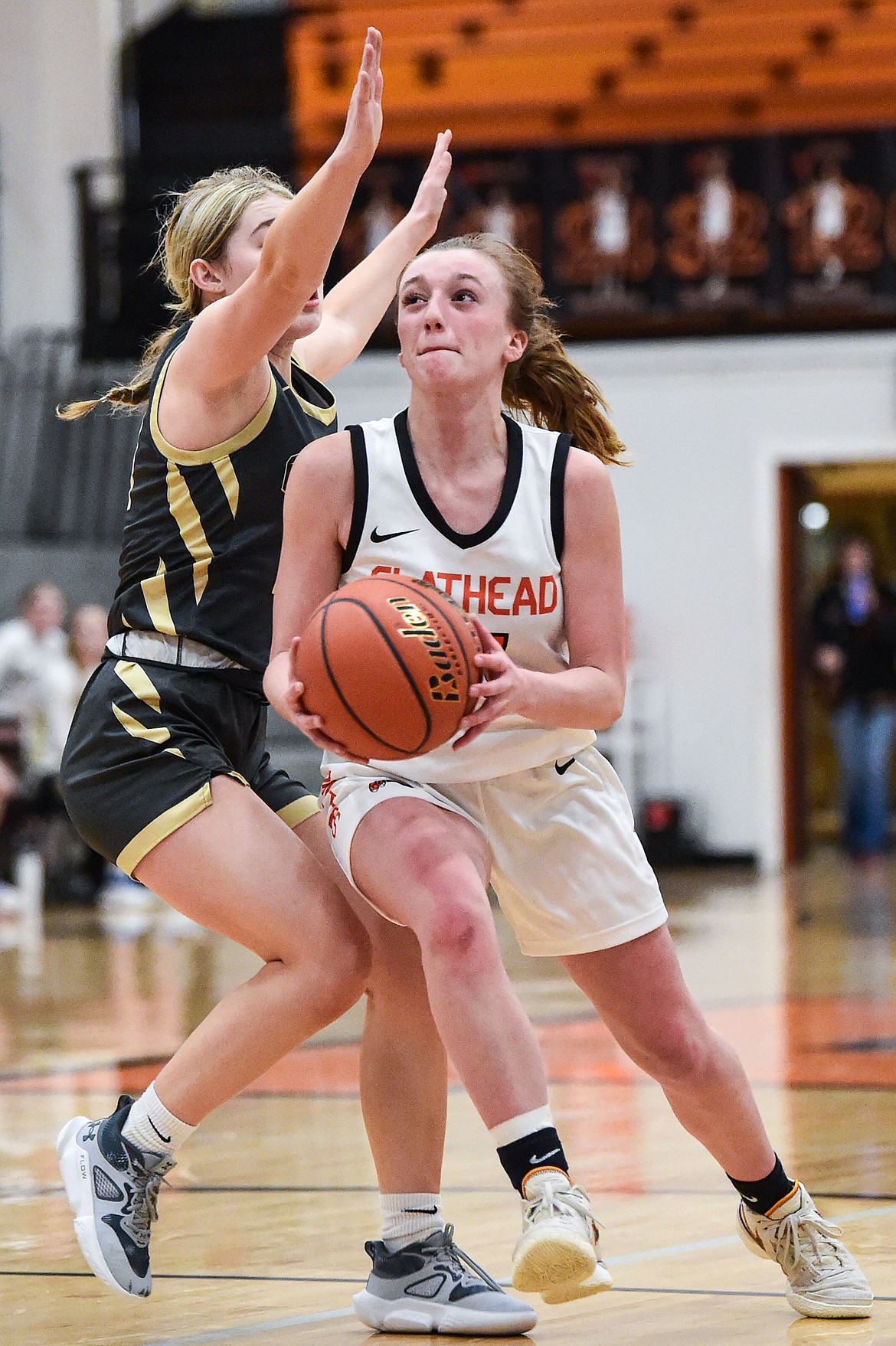 Flathead's Harlie Roth (21) drives to the basket in the fourth quarter against Helena Capital at Flathead High School on Friday, Feb. 16. (Casey Kreider/Daily Inter Lake)