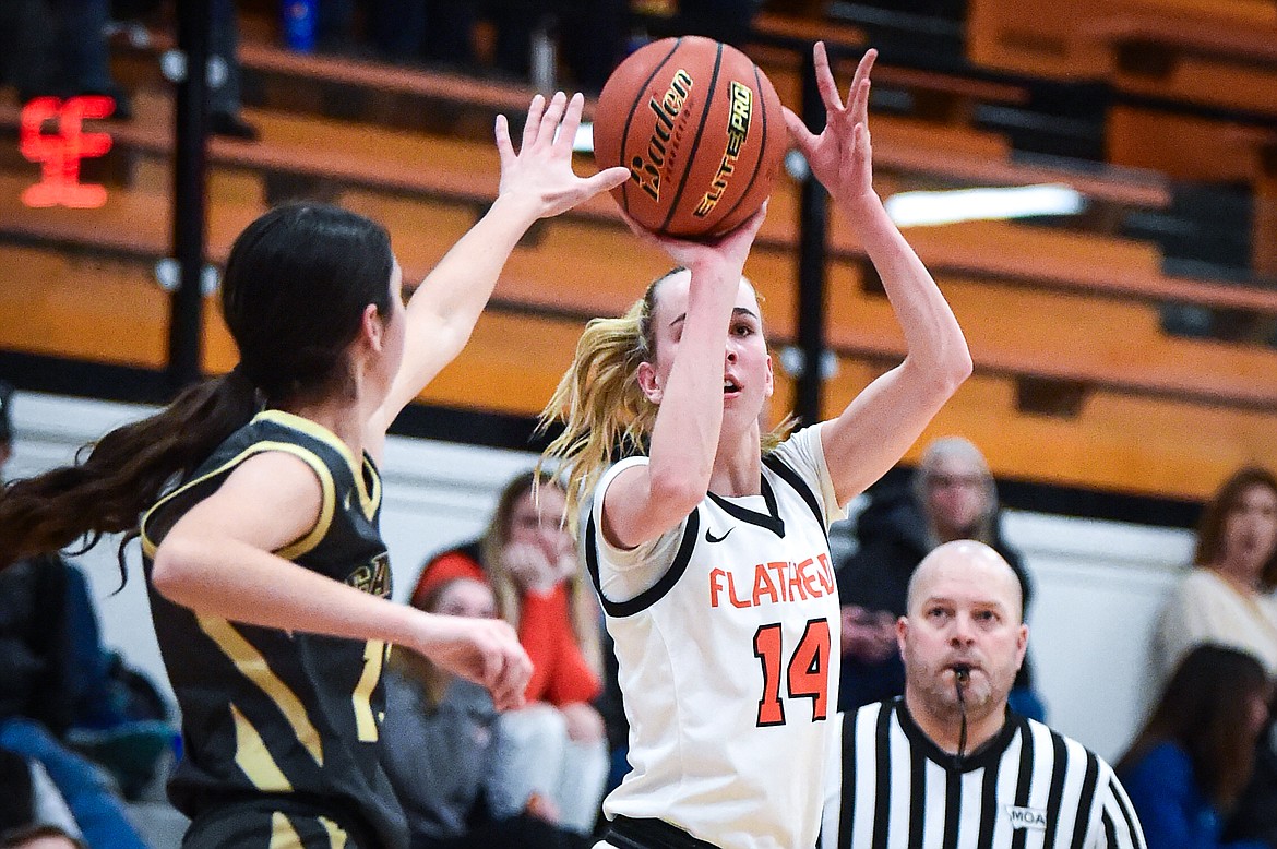 Flathead's Kennedy Moore (14) shoots in the second quarter against Helena Capital at Flathead High School on Friday, Feb. 16. (Casey Kreider/Daily Inter Lake)