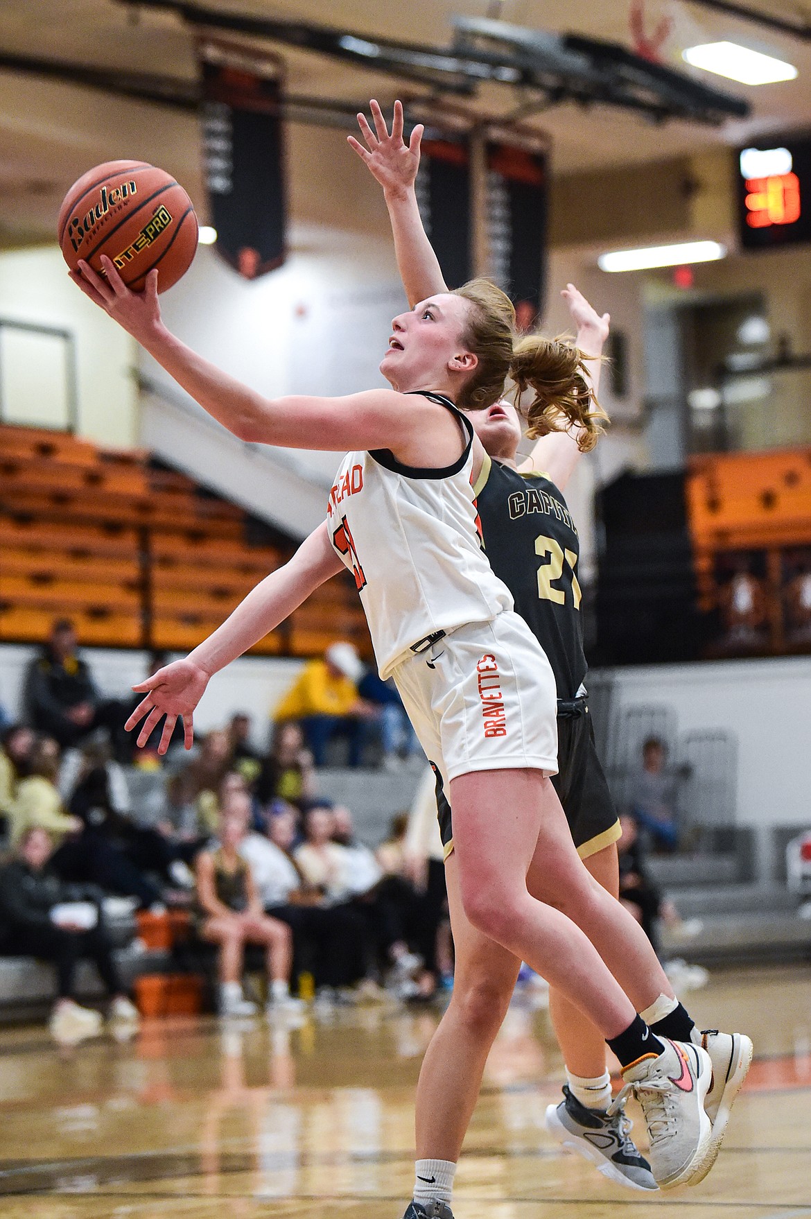 Flathead's Harlie Roth (21) drives to the basket in the fourth quarter against Helena Capital at Flathead High School on Friday, Feb. 16. (Casey Kreider/Daily Inter Lake)