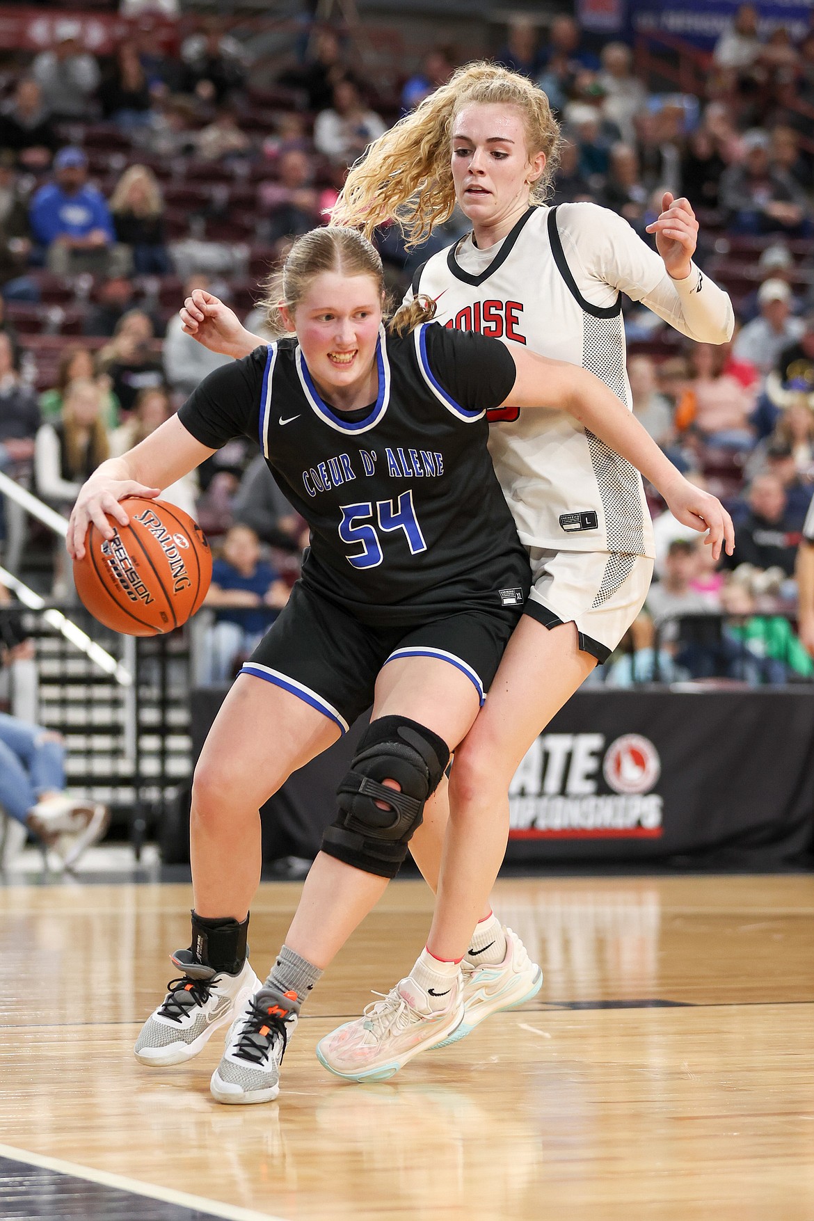 JASON DUCHOW PHOTOGRAPHY
Coeur d'Alene junior Kelsey Carroll drives to the basket against Boise in a state 5A semifinal Friday at the Ford Idaho Center in Nampa.