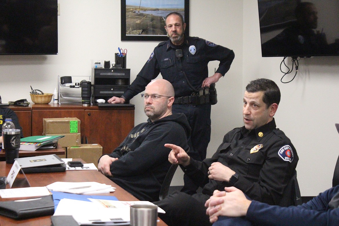 Ephrata Fire Chief Jeremy Burns, right, makes a point during a discussion on communication and emergency response while Grant County Sheriff’s Corporal Jason McDonald and Ephrata Police Chief Erik Koch listen.