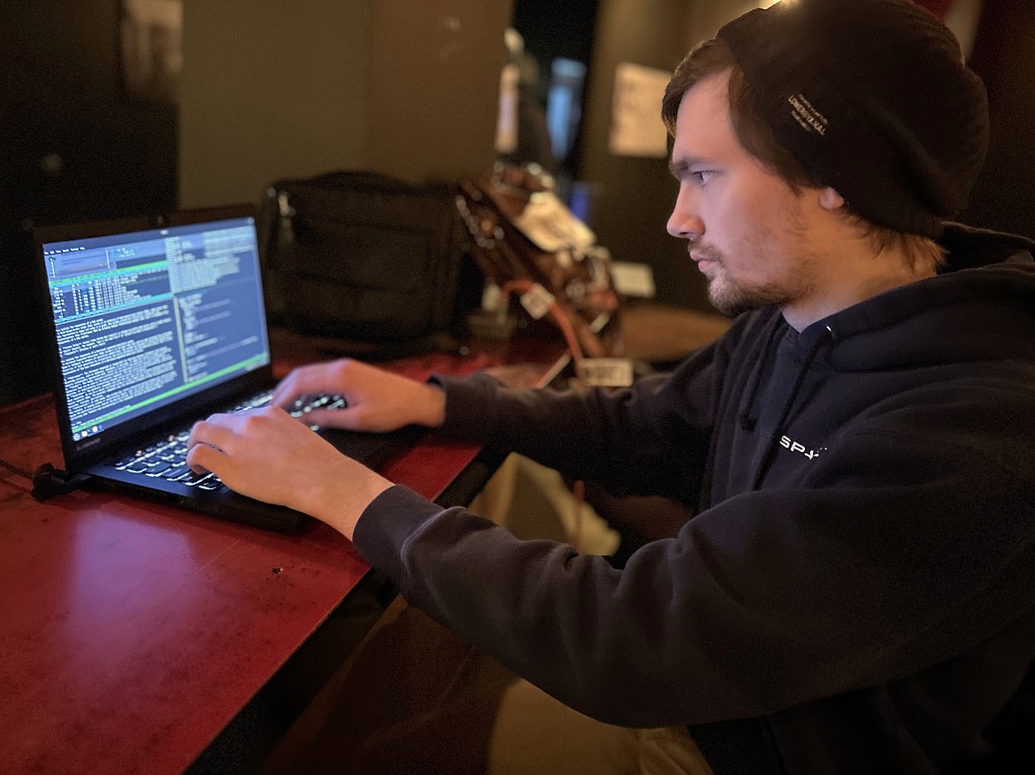 Daniel Black focuses on his work during the "Hackathon" at the Innovation Collective Den on Friday.