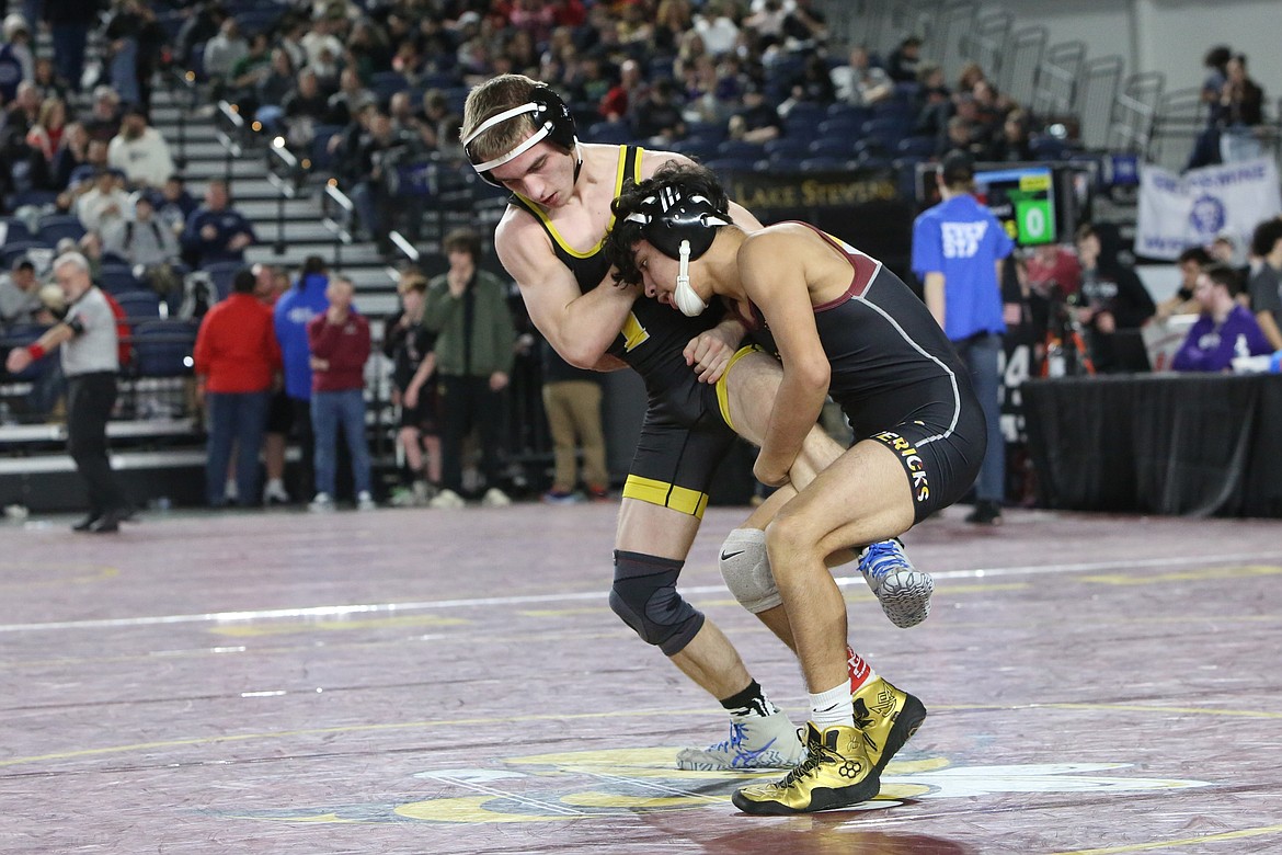 Moses Lake sophomore Ian Garza, right, wrestles at the 4A Mat Classic in Tacoma.