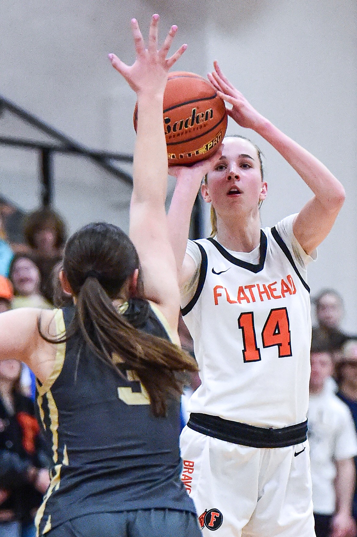 Flathead's Kennedy Moore (14) shoots in the first quarter against Helena Capital at Flathead High School on Friday, Feb. 16. (Casey Kreider/Daily Inter Lake)