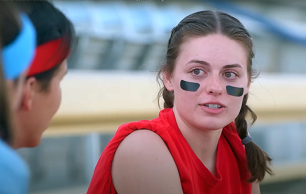 Annaka McClelland is pictured in a screenshot of an episode of the web series "Job Hoppers". In the episode, called “Code Breakers Football Showdown,” McClelland uses analogies from flag football, one of her hobbies, to explain how her job works to show host and YouTube creator Aaron Burriss.