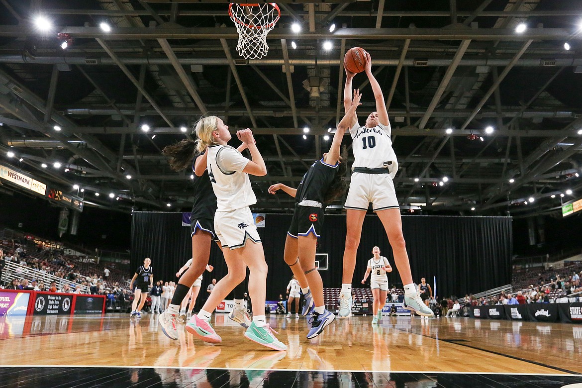 JASON DUCHOW PHOTOGRAPHY
Lake City senior Avery Waddington corrals a rebound against Coeur d'Alene in the state 5A girls basketball championship game Saturday night at the Ford Idaho Center in Nampa.