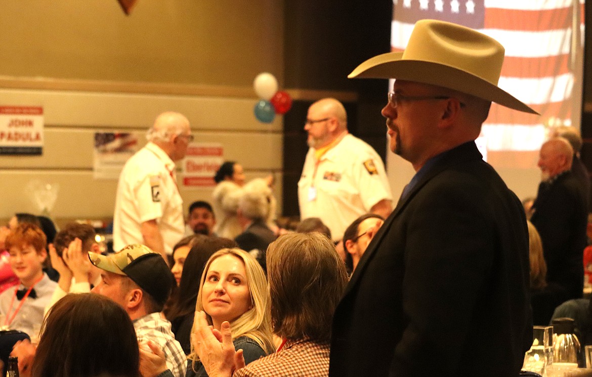 Veterans stand after being asked to do so at the Lincoln Day Dinner at The Coeur d'Alene Resort on Saturday.