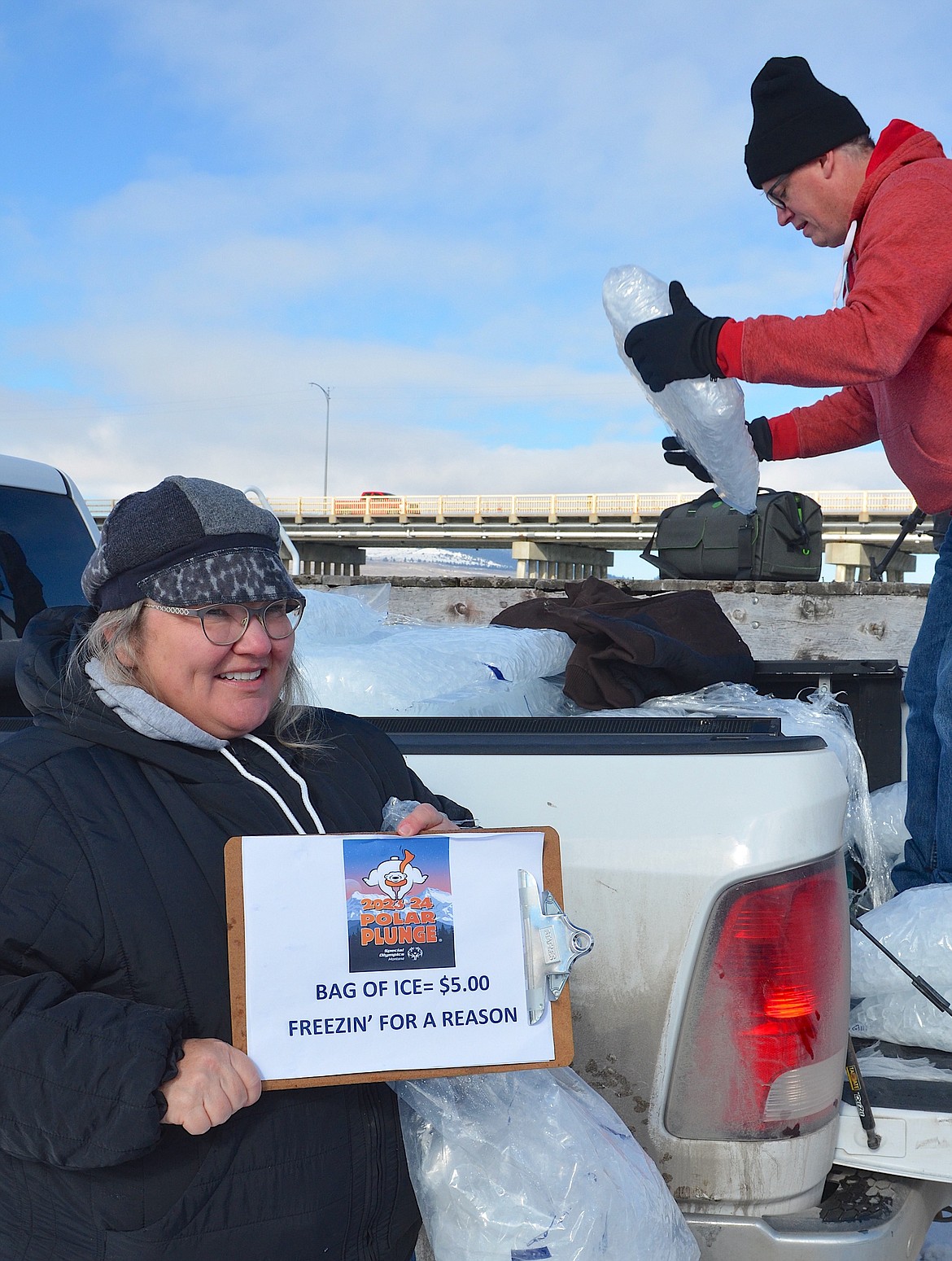 Freezin' for a Reason: Gloria and Chris Richards sold ice, donated by VW Ice of Missoula, for $5 a bag to help chill the already chilly water during Saturday's Shiver in the River, a benefit for Special Olympics.