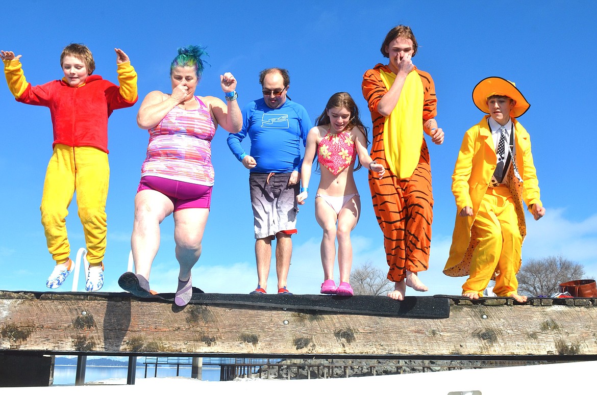 Crew of costumed plungers bravely leaped into frigid water at Riverside Park in Polson this year during a benefit for Special Olympics Montana. (Kristi Niemeyer/Leader)
