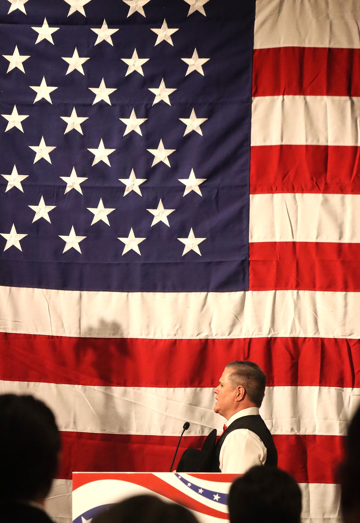Kootenai County Sheriff Bob Norris leads the Pledge of Allegiance at the Lincoln Day Dinner at The Coeur d'Alene Resort on Saturday.