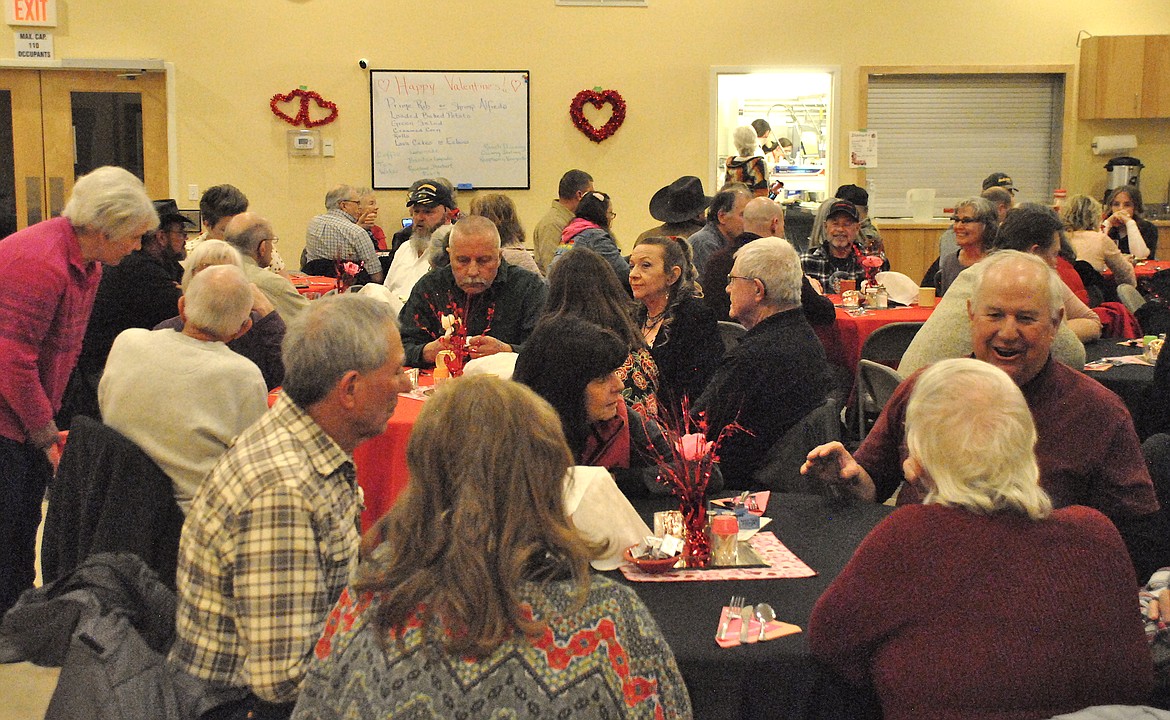 Love was in the air, and prime rib was on the tables during the Valentine's Day Dinner at the St. Regis Senior Center. Guests dined and visited with friends and neighbors while volunteers and students served up dinner, drinks, and dessert. (Mineral Independent/Amy Quinlivan)