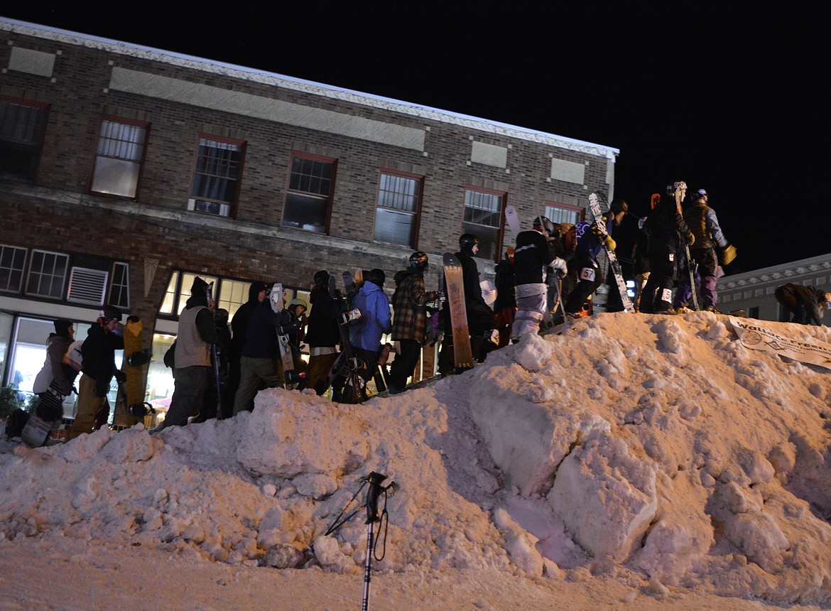 Skiers and snowboarders wait for their turn to show off their stunts on the rails during the rail jam in downtown Wallace. About 40 local and national competitors gathered over Presidents Day weekend to take part in Extreme SkiJor.