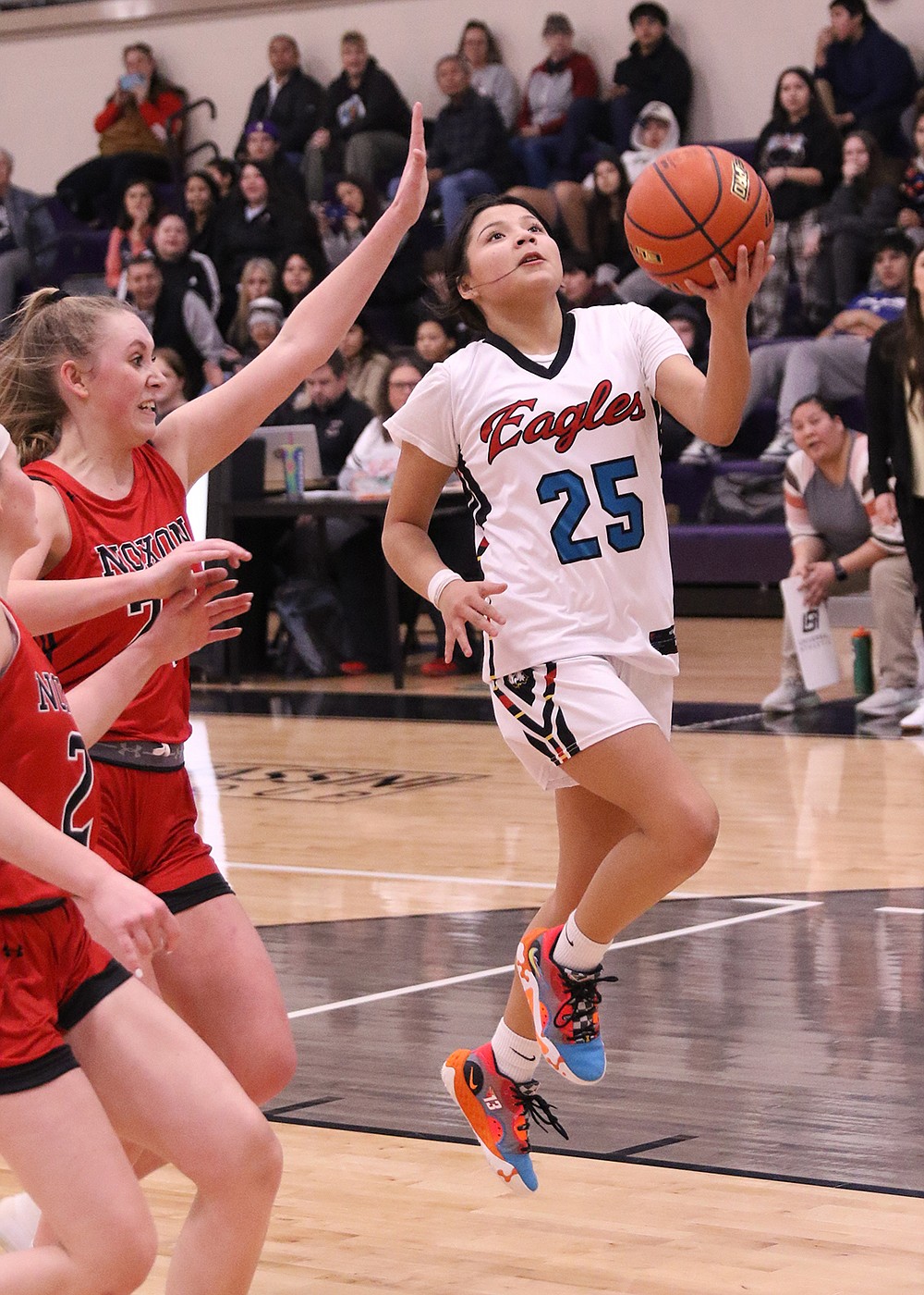 Two Eagle's Keke Tenas goes for a layup against Noxon during last weekend's Class C District Tournament. (Bob Gunderson photo)