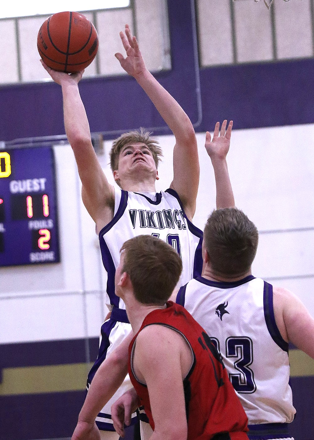 Charlo's Wesley Anderson rises above the Noxon defenders during last weekend's Class C District Tournament in Polson. (Bob Gunderson photo)