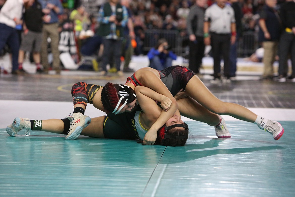 Othello freshman Grayce Mendez, right, placed fourth in the 2A/1A/B Girls 110-pound class at the Mat Classic Saturday.