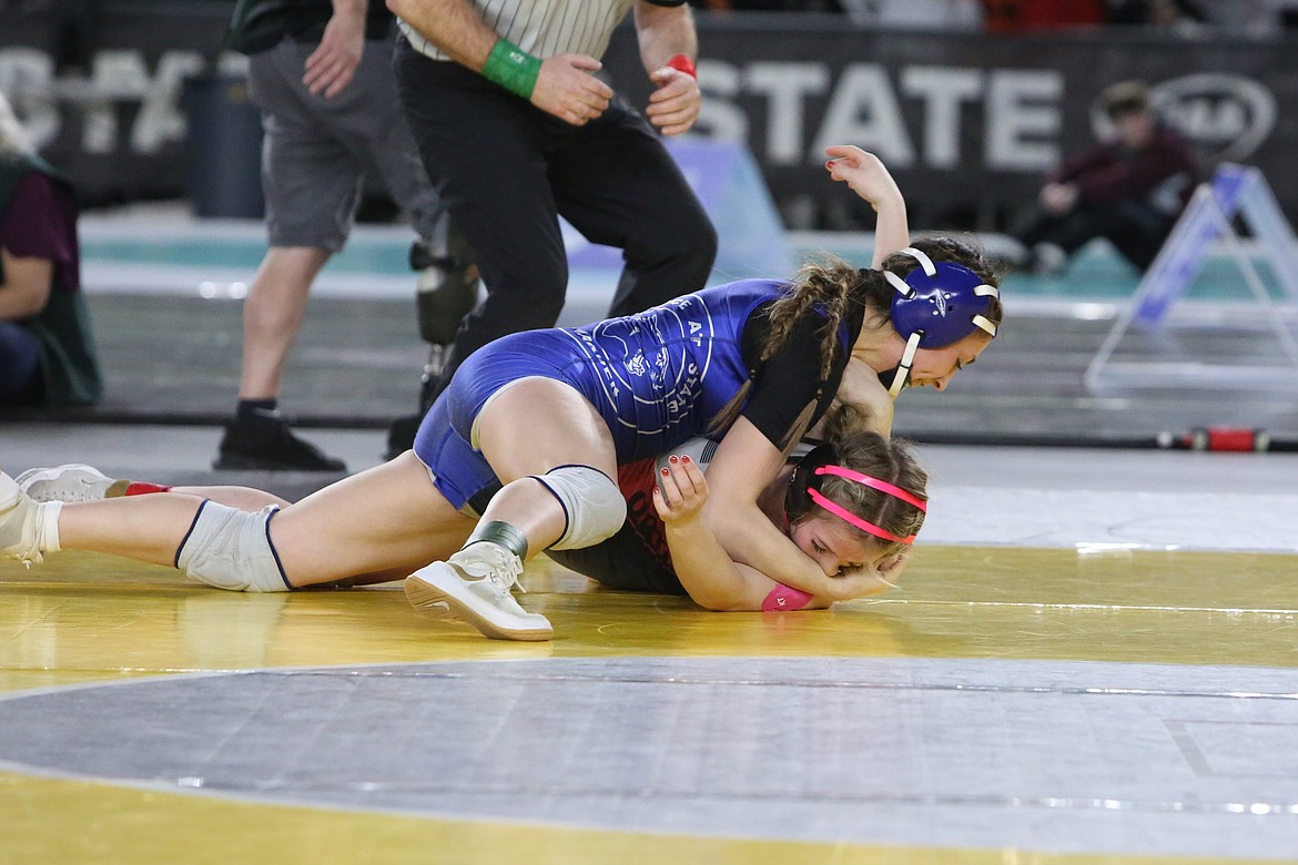 Warden senior Jada Hernandez, top, won a state championship in the 2A/1A/B Girls 120-pound bracket at the Mat Classic last week.