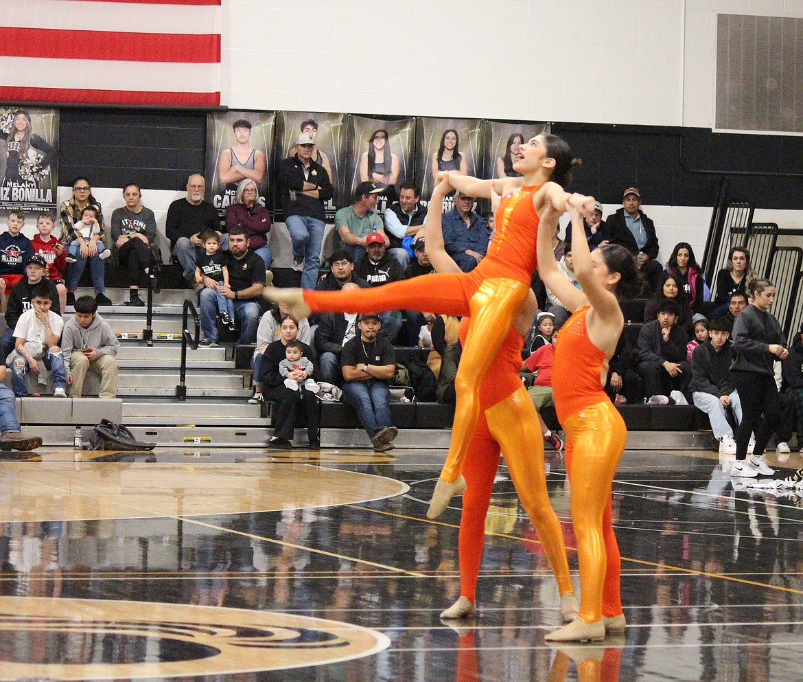 Royal High School dance team members perform at a game in early February. Royal School District voters are approving an educational programs and operations levy that pays for extracurricular activities among other things.