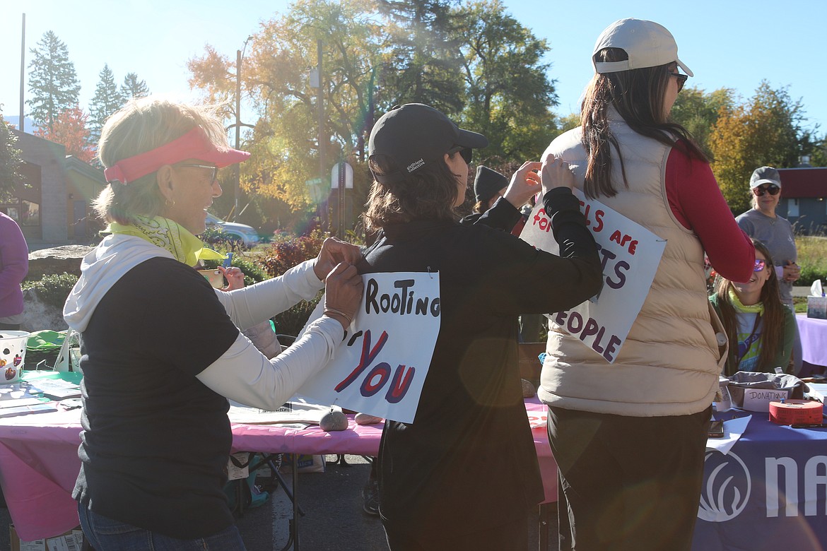 Dawn Mehra, president of NAMI Far North, pictured far left helps as part of a sign train at the grassroots organization's NAMI Walk held this fall. The group's new effort — the Sand Creek Clubhouse — will provide recovery-based programs for those living with mental health conditions.