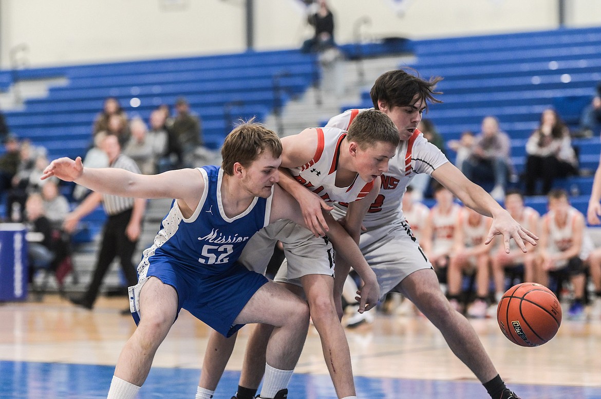 Mission's Jak Starkel skirmishes with Plains players for the ball during last week's Western 7B District Tournament in St. Ignatius. (Christa Umphrey photo)