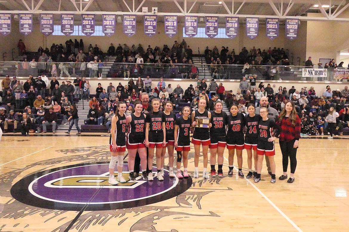 Hot Springs Lady Heat players with their hardware at the end of their District 14C championship game versus Charlo Saturday evening in Polson.  (Chuck Bandel/VP-MI)