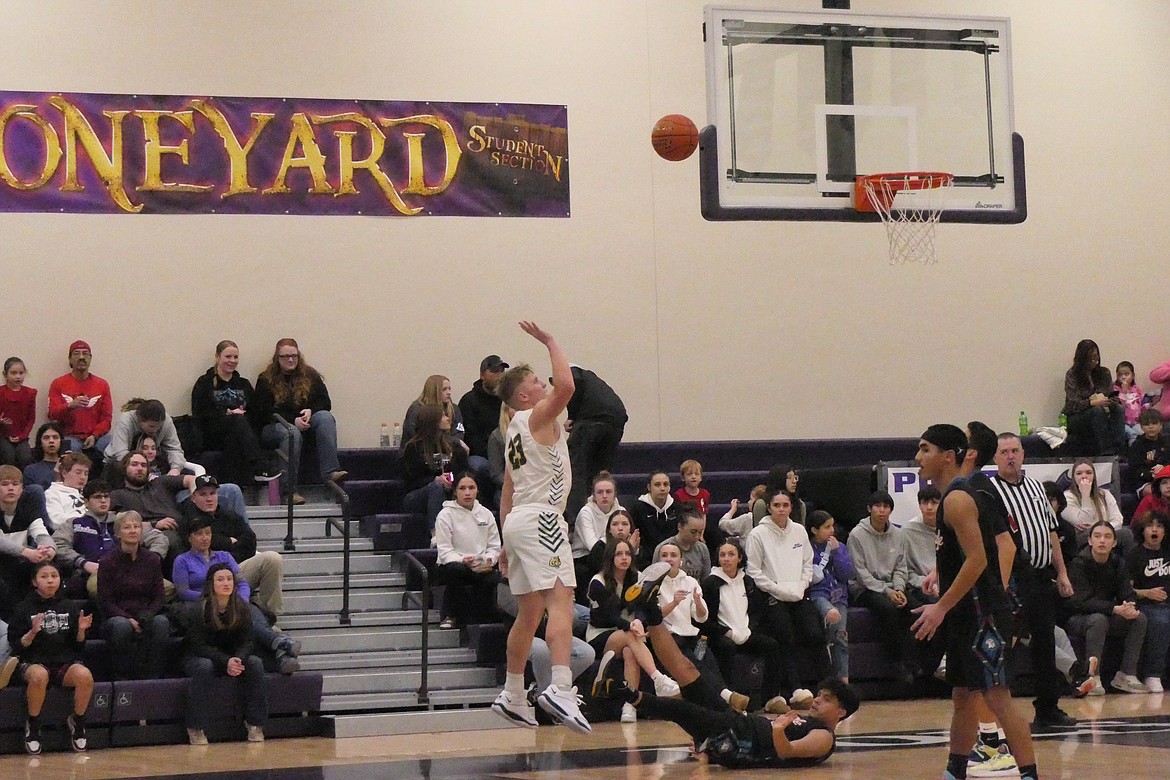 St. Regis standout forward John Pruitt goes up for two of his game-high 21 points during the Tigers' championship win over Two Eagle River Saturday night in Polson.  (Chuck Bandel/VP-MI)