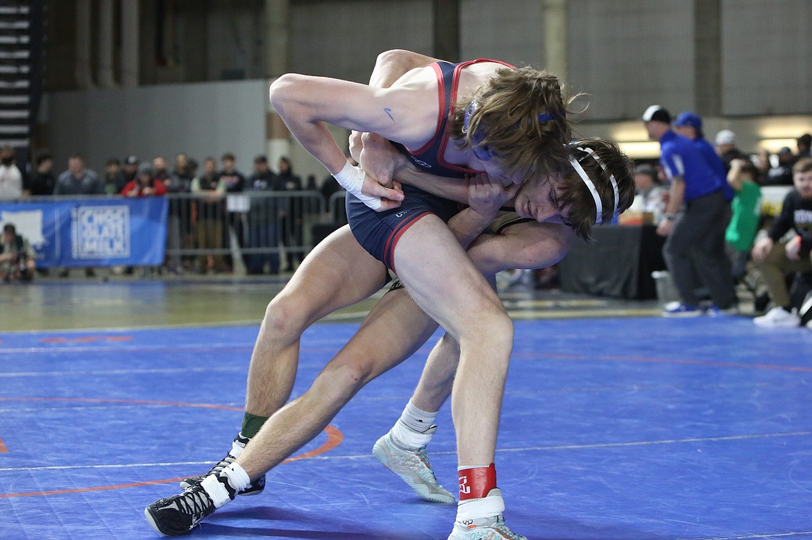 Royal sophomore Shea Stevenson, right, attempts to take down his opponent in the 1A Boys 150-pound semifinals.