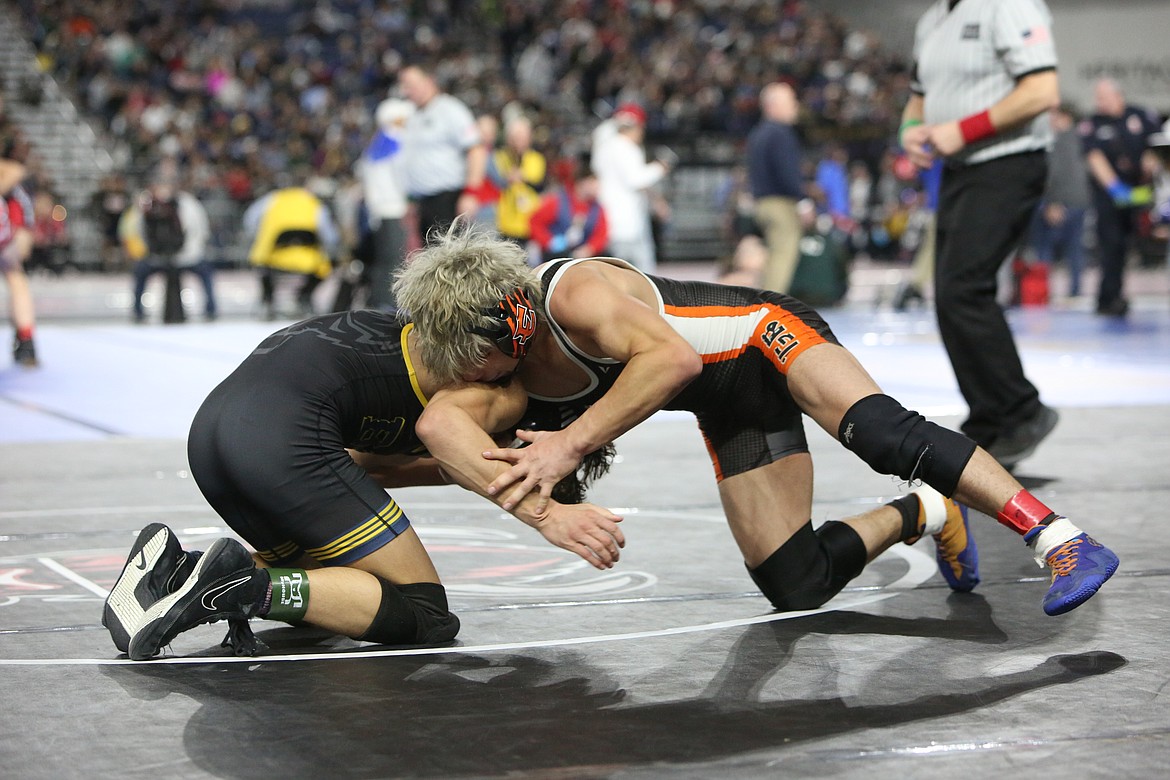 Ephrata senior Alex Guitterez, right, took fifth in the 2A Boys 120-pound class at the Mat Classic in Tacoma.