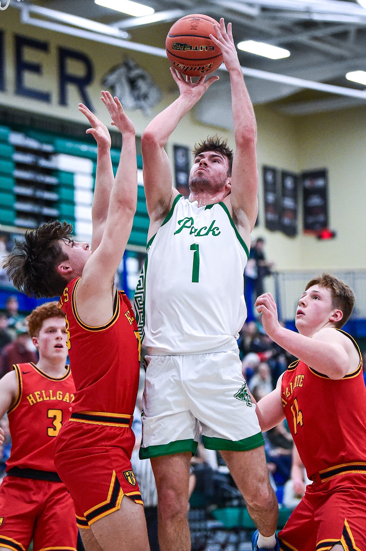 Glacier's Cohen Kastelitz (1) puts in a basket after grabbing an offensive rebound in the first half against Missoula Hellgate at Glacier High School on Tuesday, Feb. 20. (Casey Kreider/Daily Inter Lake)